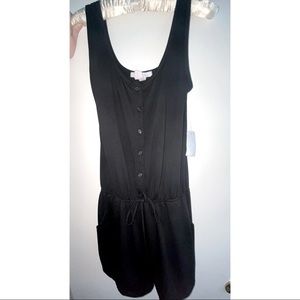 New with tags, black sleeveless romper.